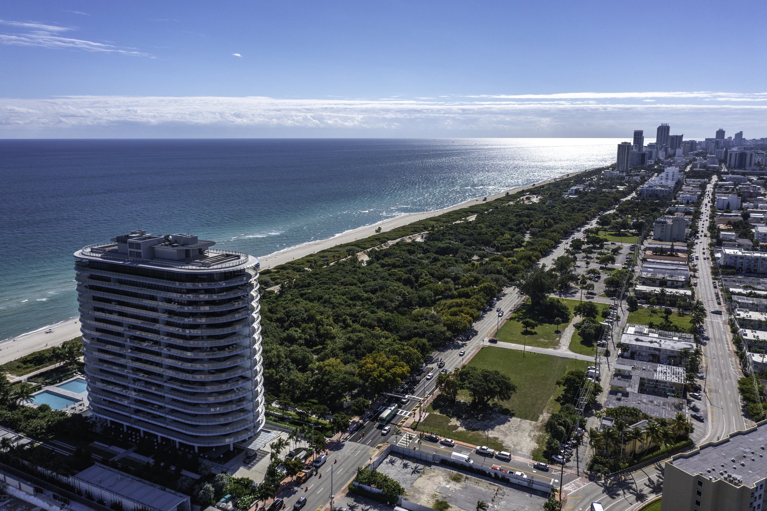 Coast line with condo building in foreground